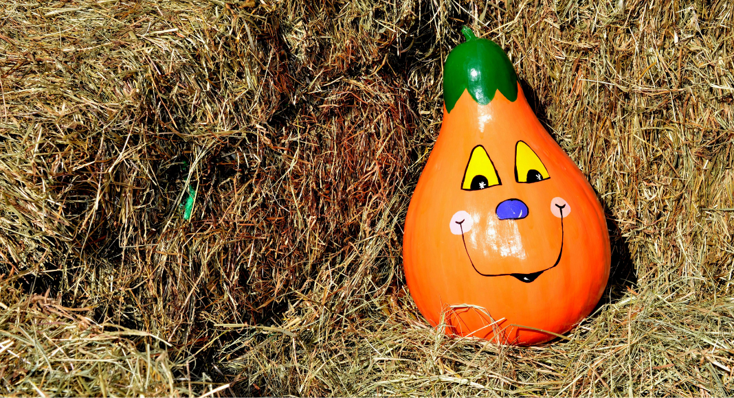 painted pumpkin in haystack
