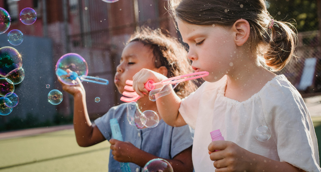 kids blowing bubbles